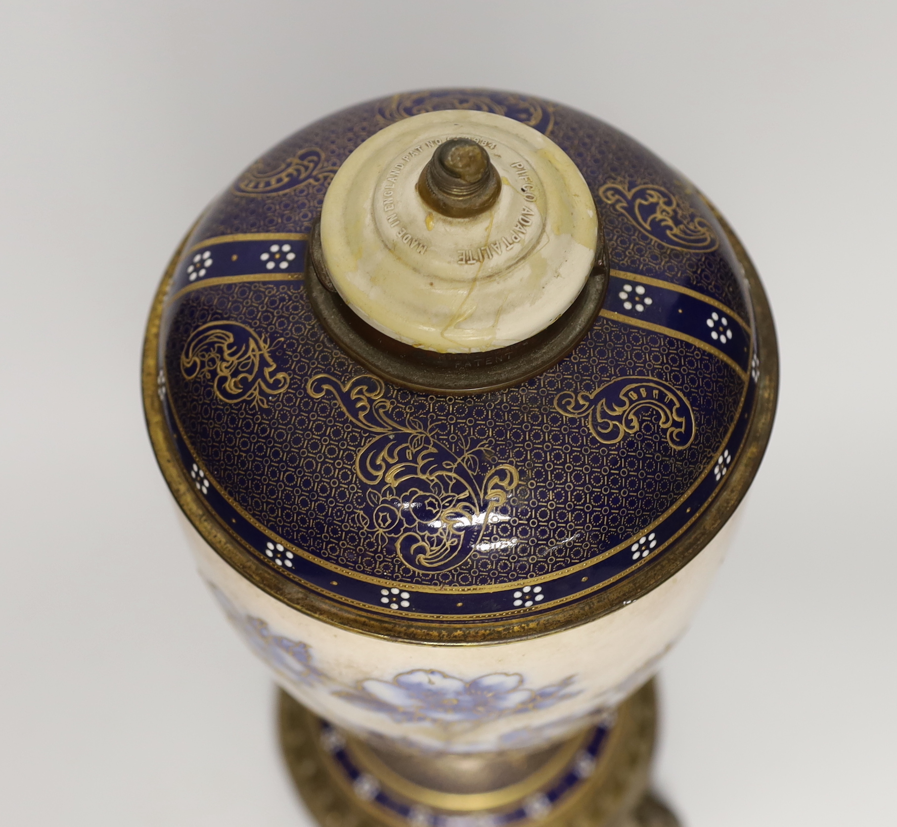 A Victorian gilt-metal mounted ceramic lamp base, 37cm tall